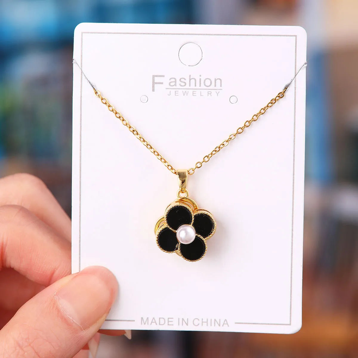 X5835# Rotating Pearl Black Flower