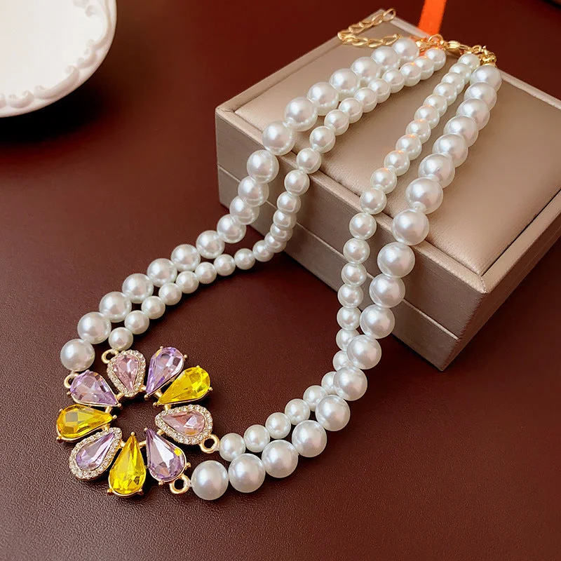 Double layered necklace with diamond studded water droplets and pearls