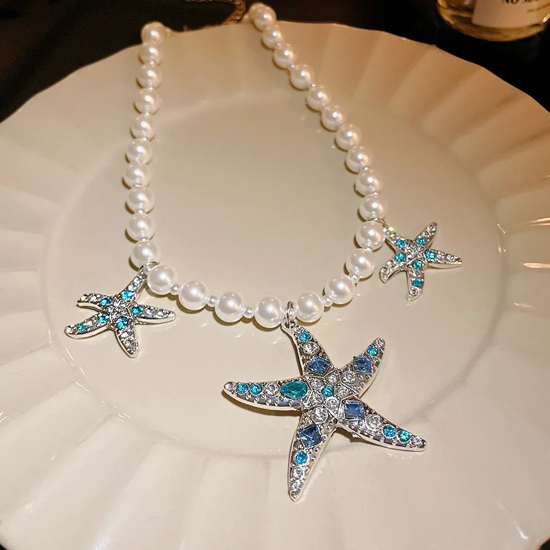 Diamond studded pearl starfish necklace